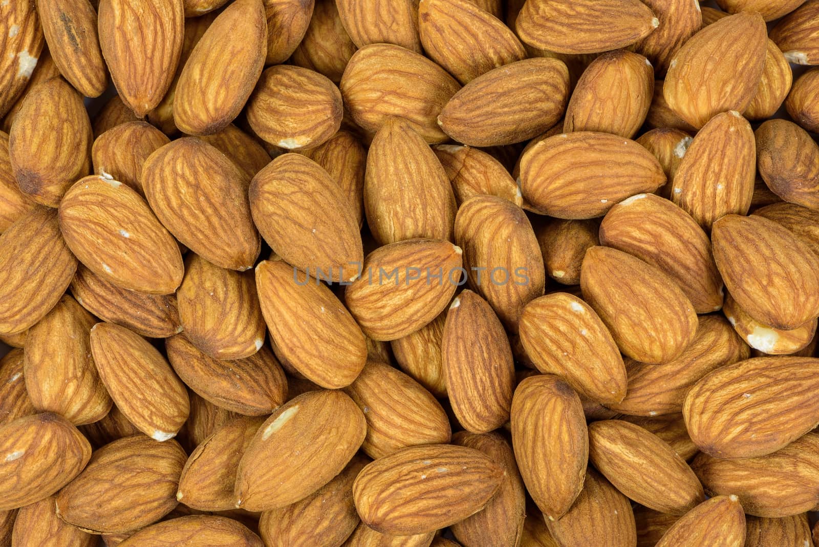 Top view of of heap of almonds as a natural background