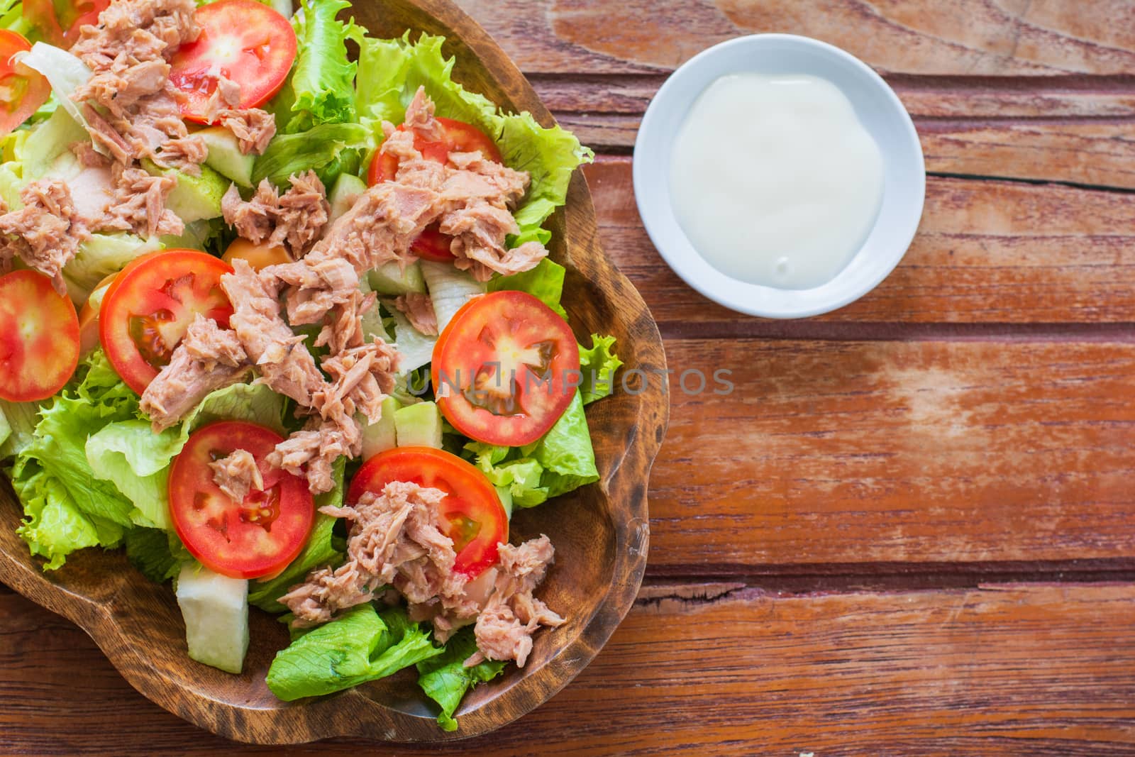 Tuna salad with red raw tomato, fresh lettuce. Hight vitamins and low fat for loose weight. Heathy food concept.