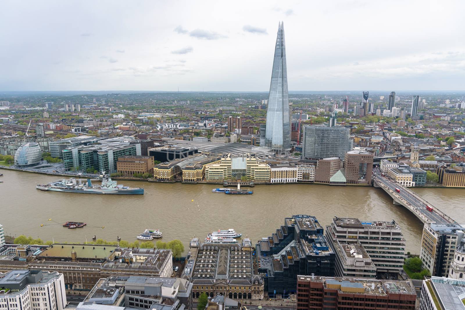 Aerial view of the river Thames in central London on a cloudy day
