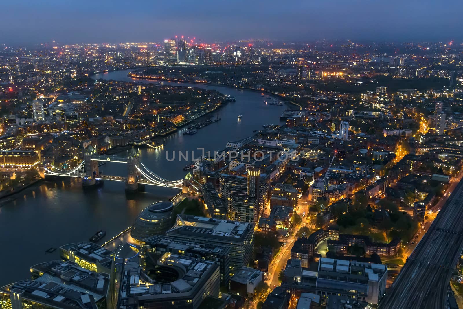 Aerial view of river Thames in London at night by mkos83