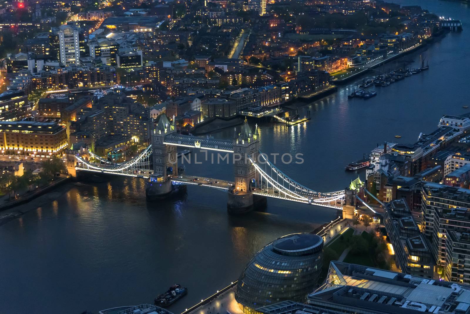 Aerial view of Tower Bridge in London at night by mkos83