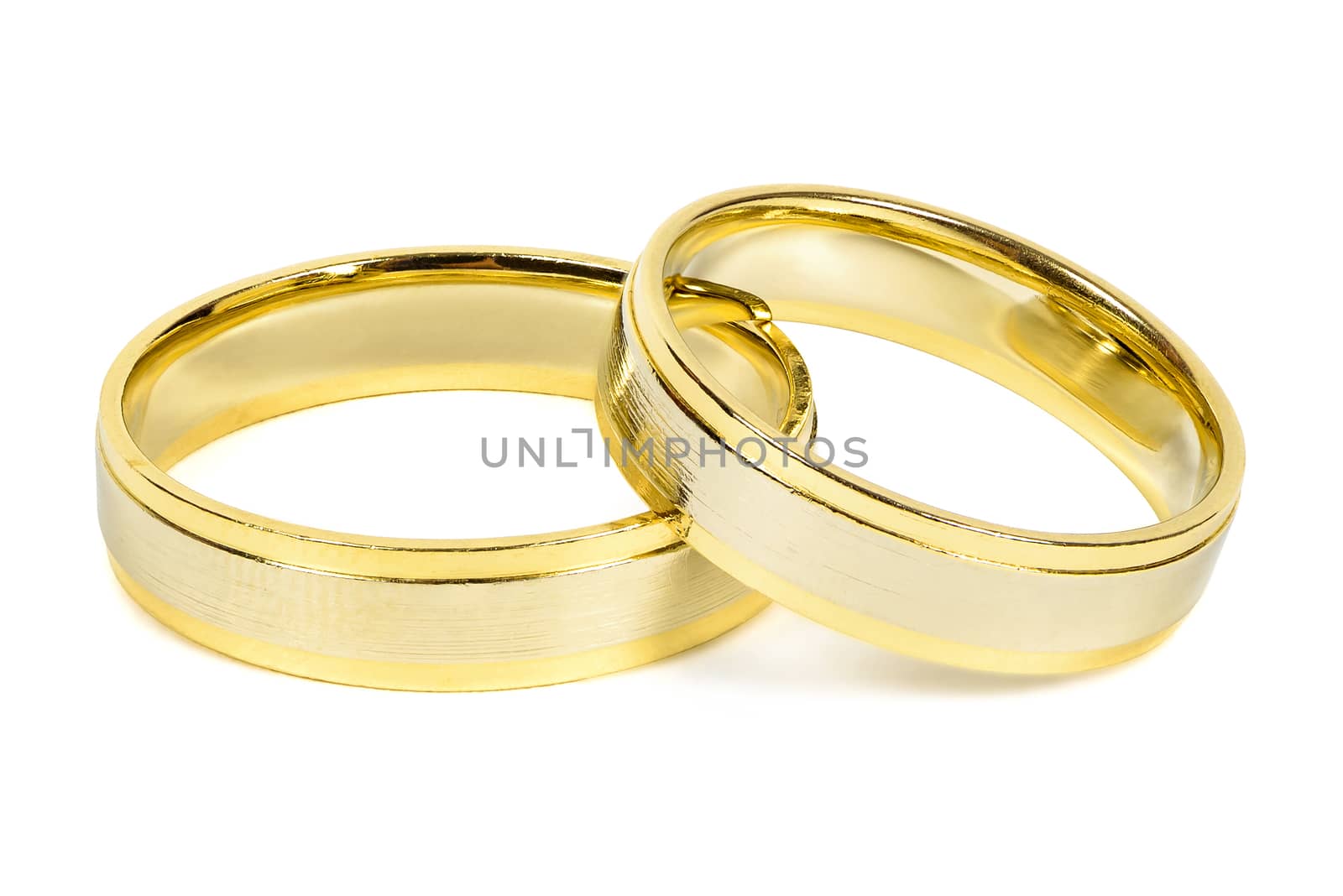 Golden wedding rings isolated on white background with clipping path