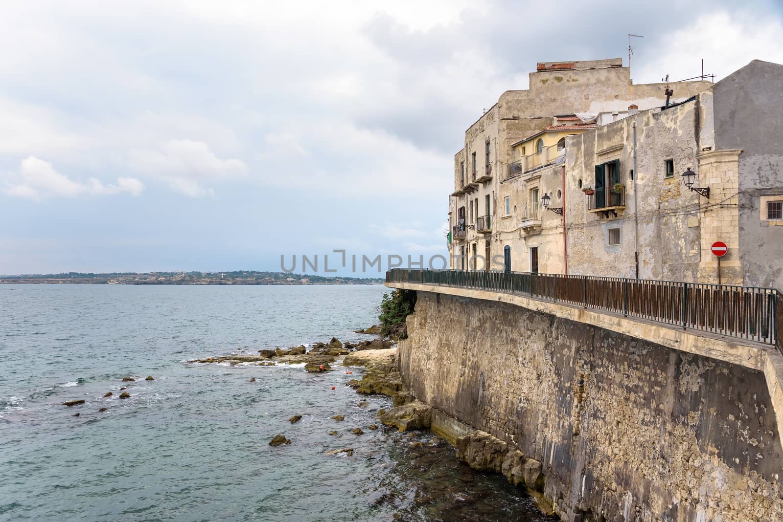 Waterfront of Ortygia Island with small pebble beach by mkos83