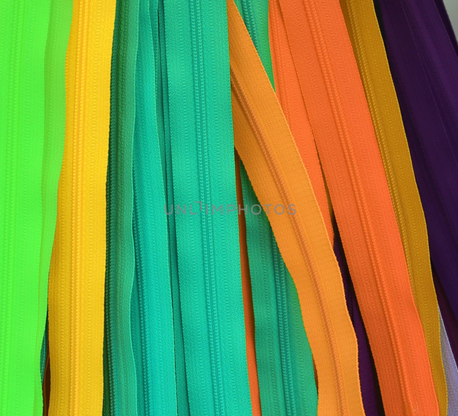 Detailed close up view on samples of cloth and fabrics in different colors found at a fabrics market.