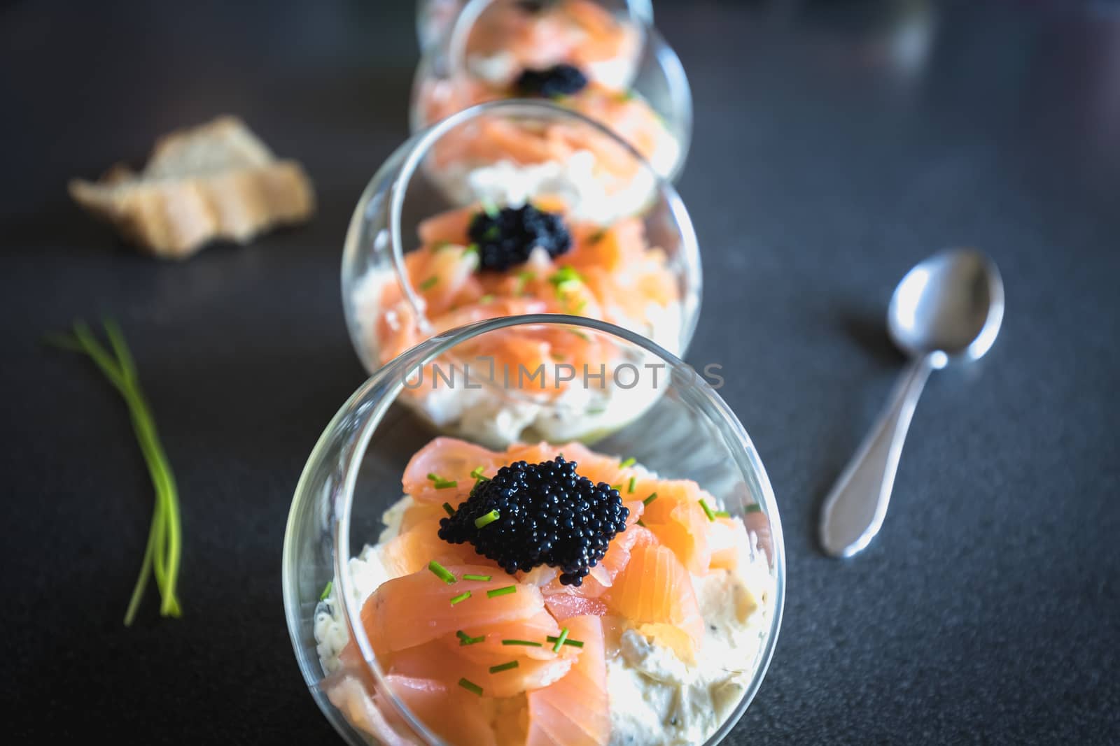 verrine salmon lumpfish egg fresh cheese and avocado bed in the kitchen