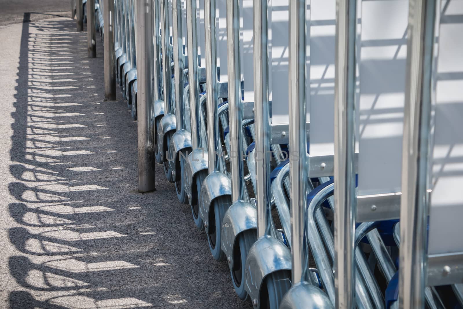 carry cart outside an airport available to travelers to move their luggage