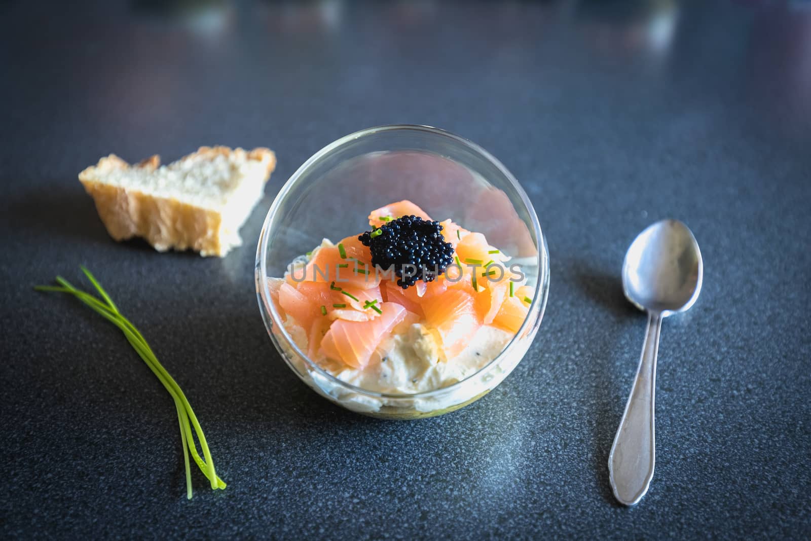 verrine salmon lumpfish egg fresh cheese and avocado bed in the kitchen