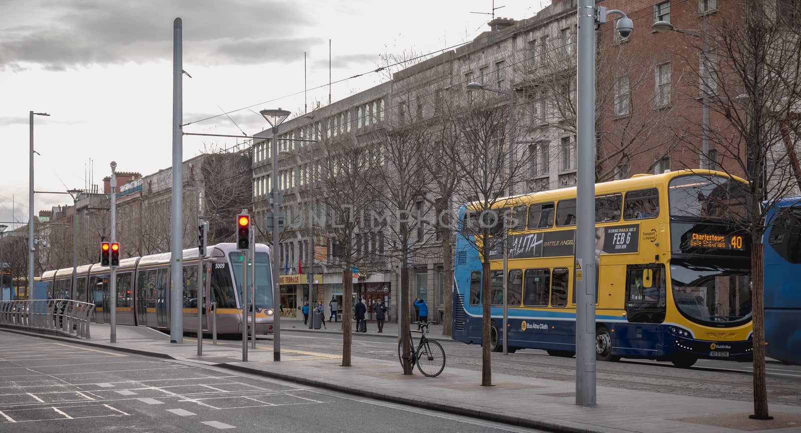 ypical Irish double decker bus running and an electric tram  in  by AtlanticEUROSTOXX