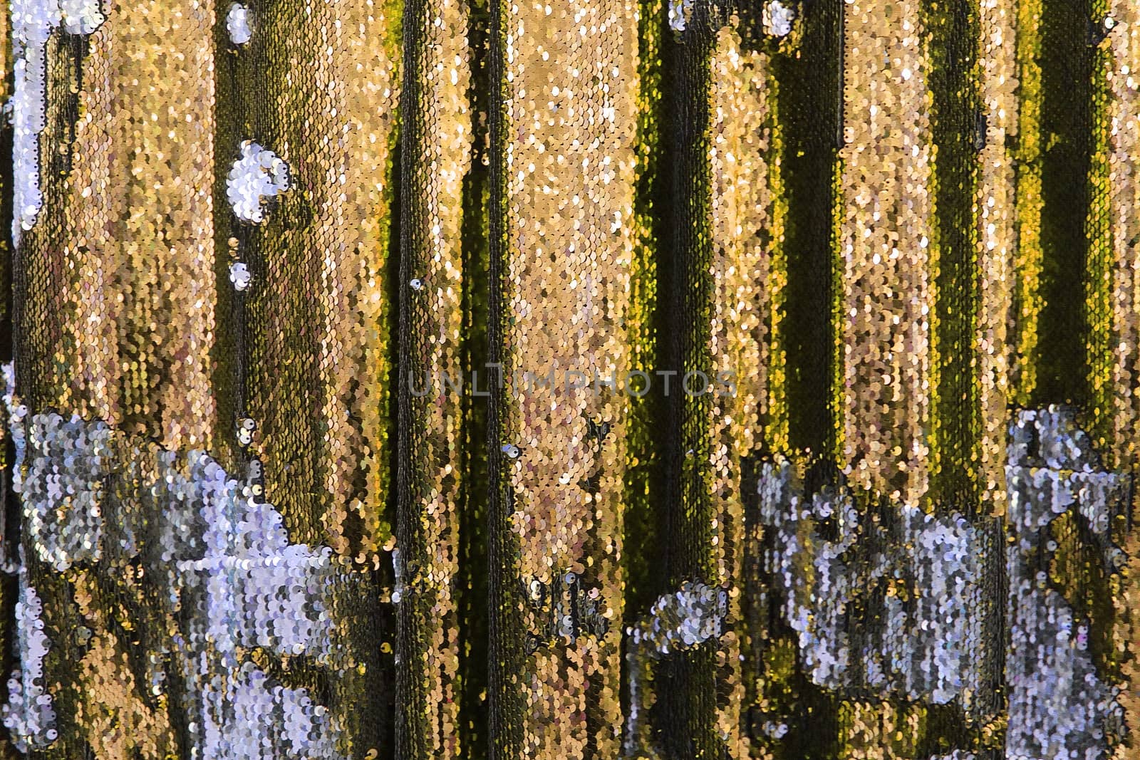 Detailed close up view on samples of cloth and fabrics in different colors found at a fabrics market.