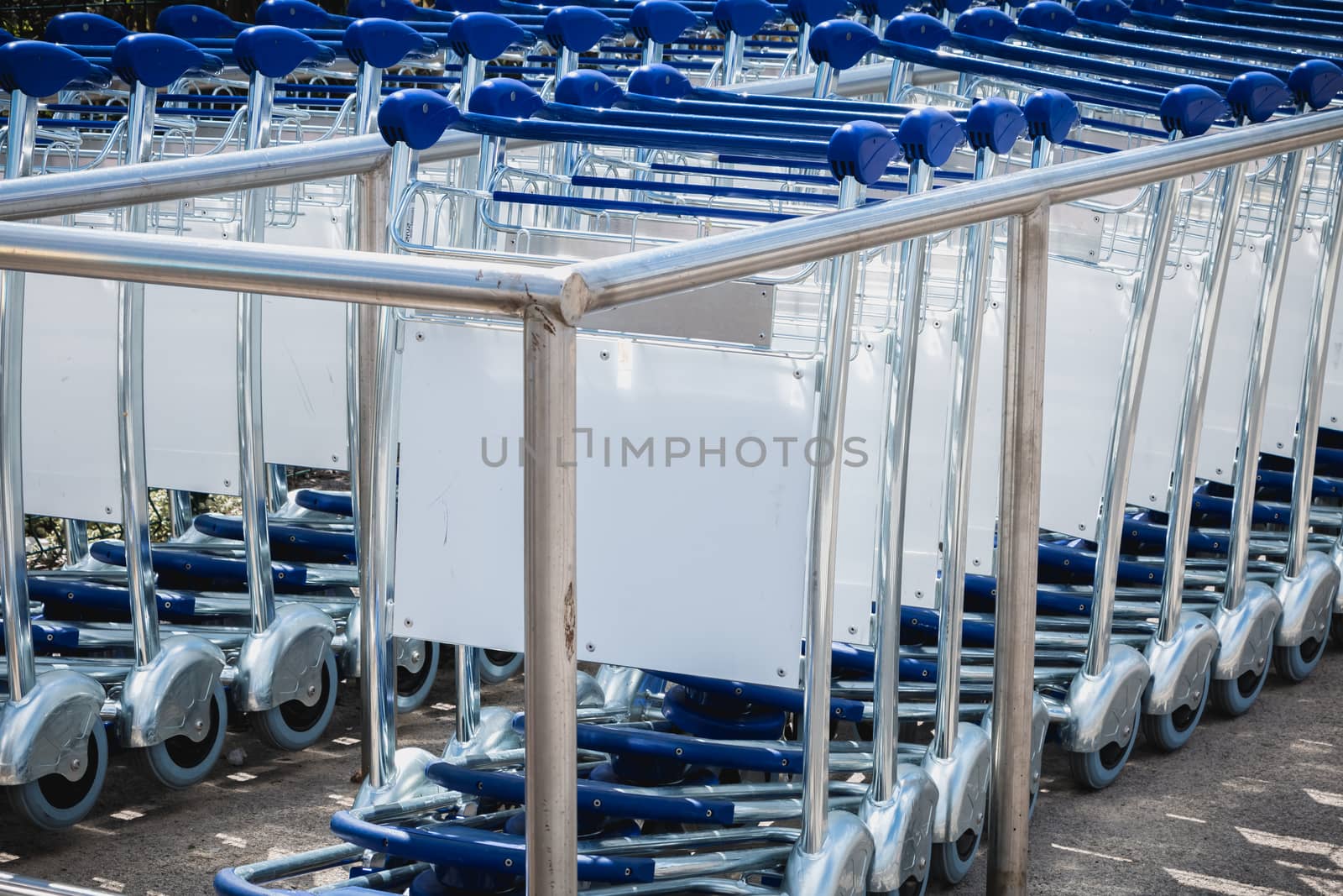 carry cart outside an airport available to travelers to move their luggage