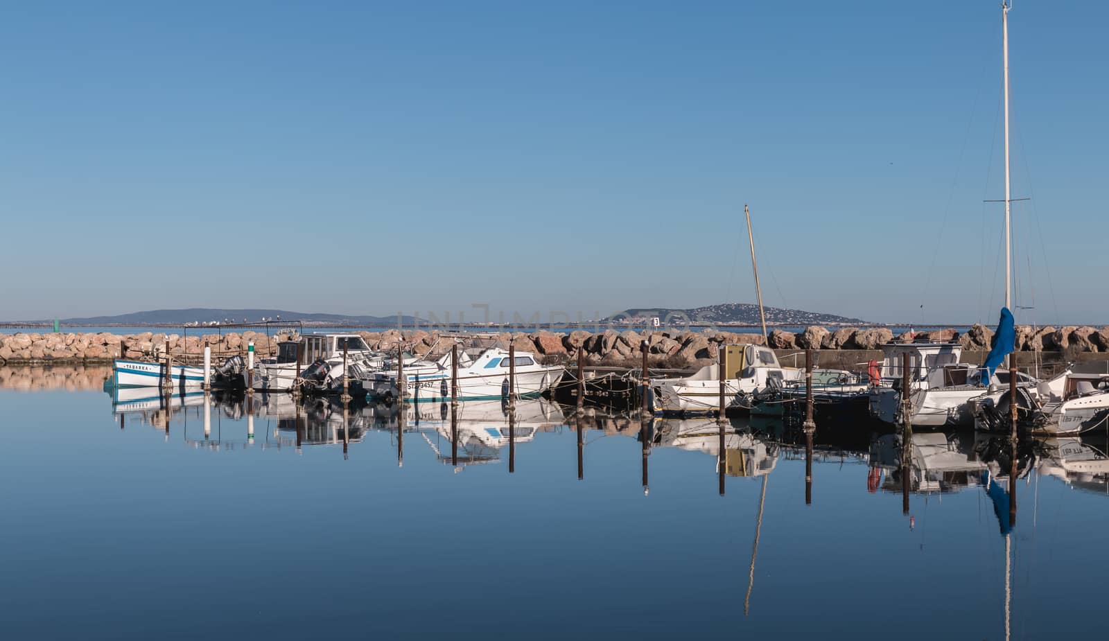 Marseillan, France - January 3, 2019: view of a small port in the south of France in Marseillan village where are moored small pleasure boats on a winter day