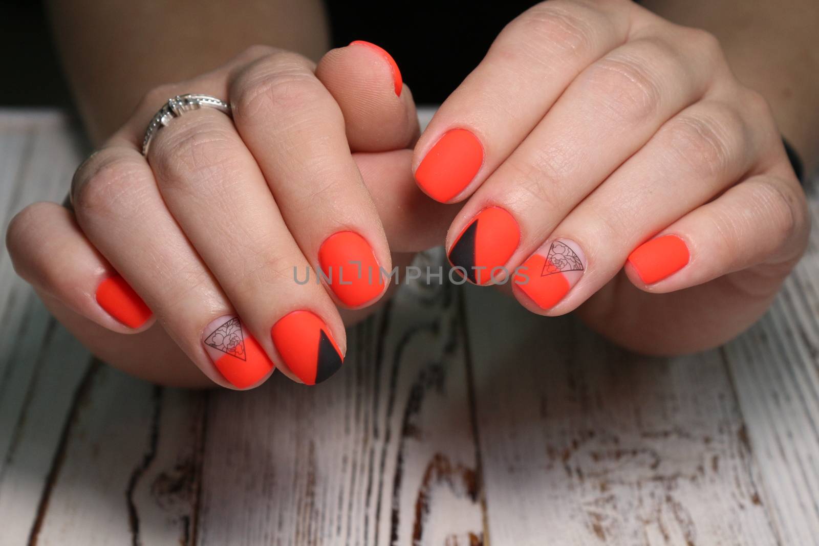 Multi-colored pastel manicure combined tone on tone with a striped background.Nail art by SmirMaxStock