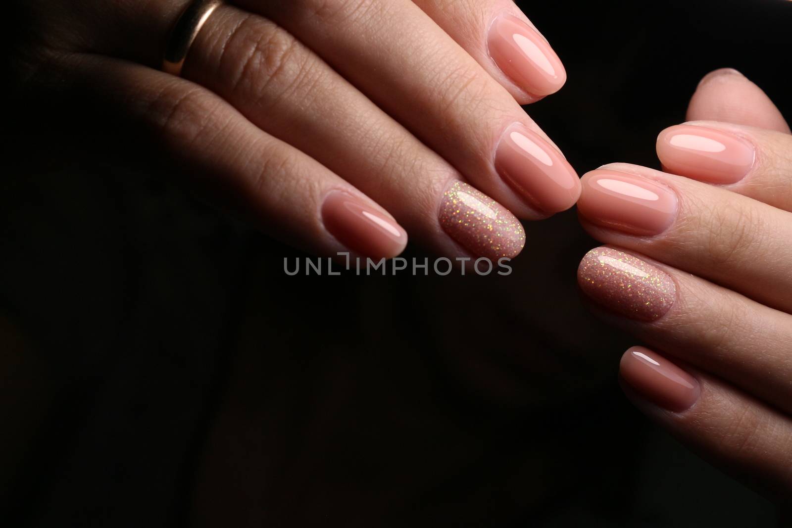 Multi-colored pastel manicure combined tone on tone with a striped background.