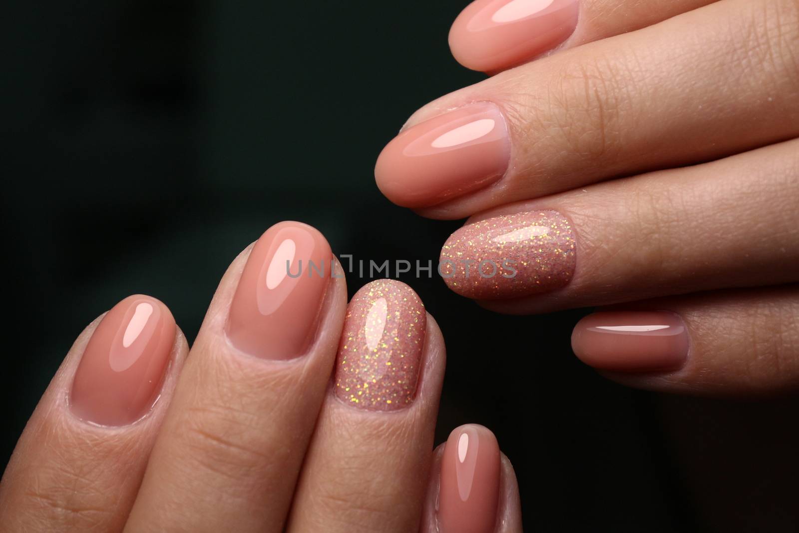 Multi-colored pastel manicure combined tone on tone with a striped background.