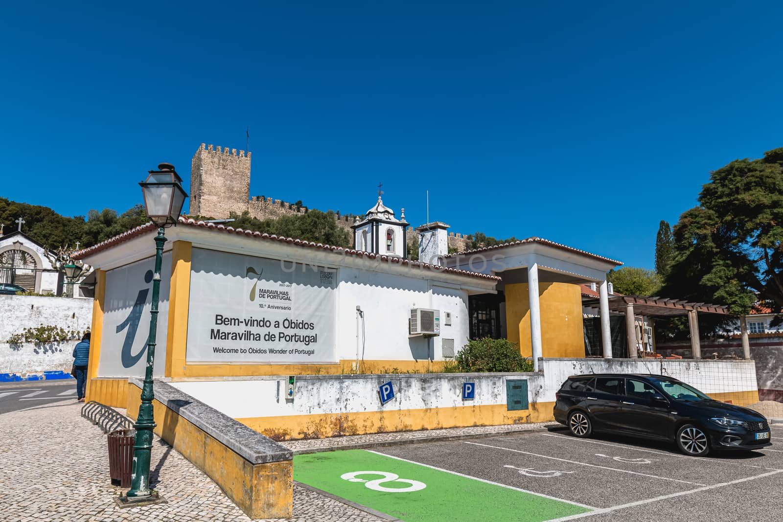 Obidos, Portugal - April 12, 2019: View of the tourist information point at the entrance to the historic city on a spring day