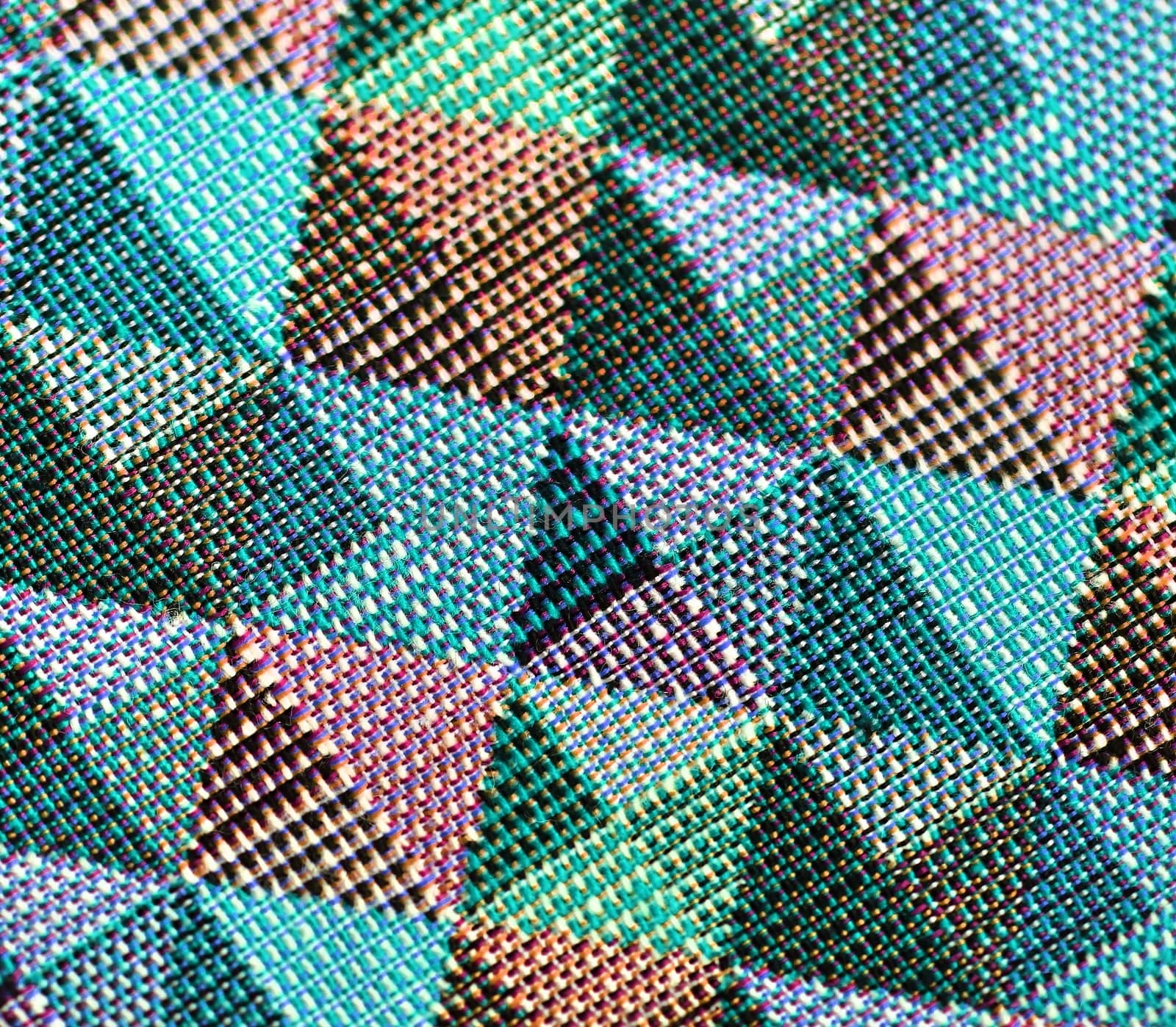 Detailed close up view on samples of cloth and fabrics in different colors found at a fabrics market.