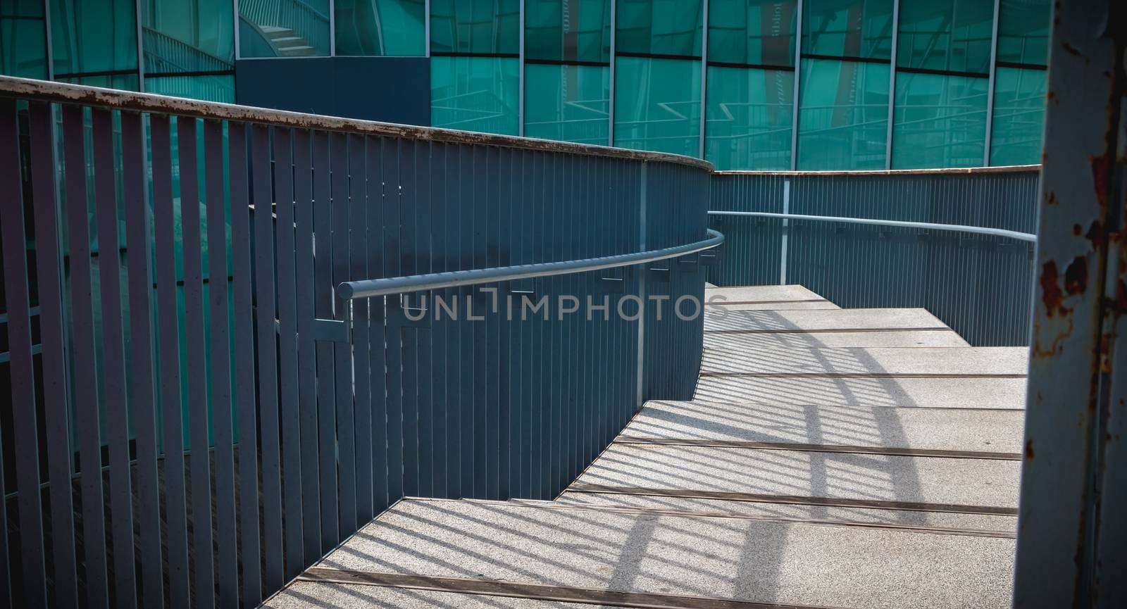 modern public staircase viewed from above descending by AtlanticEUROSTOXX
