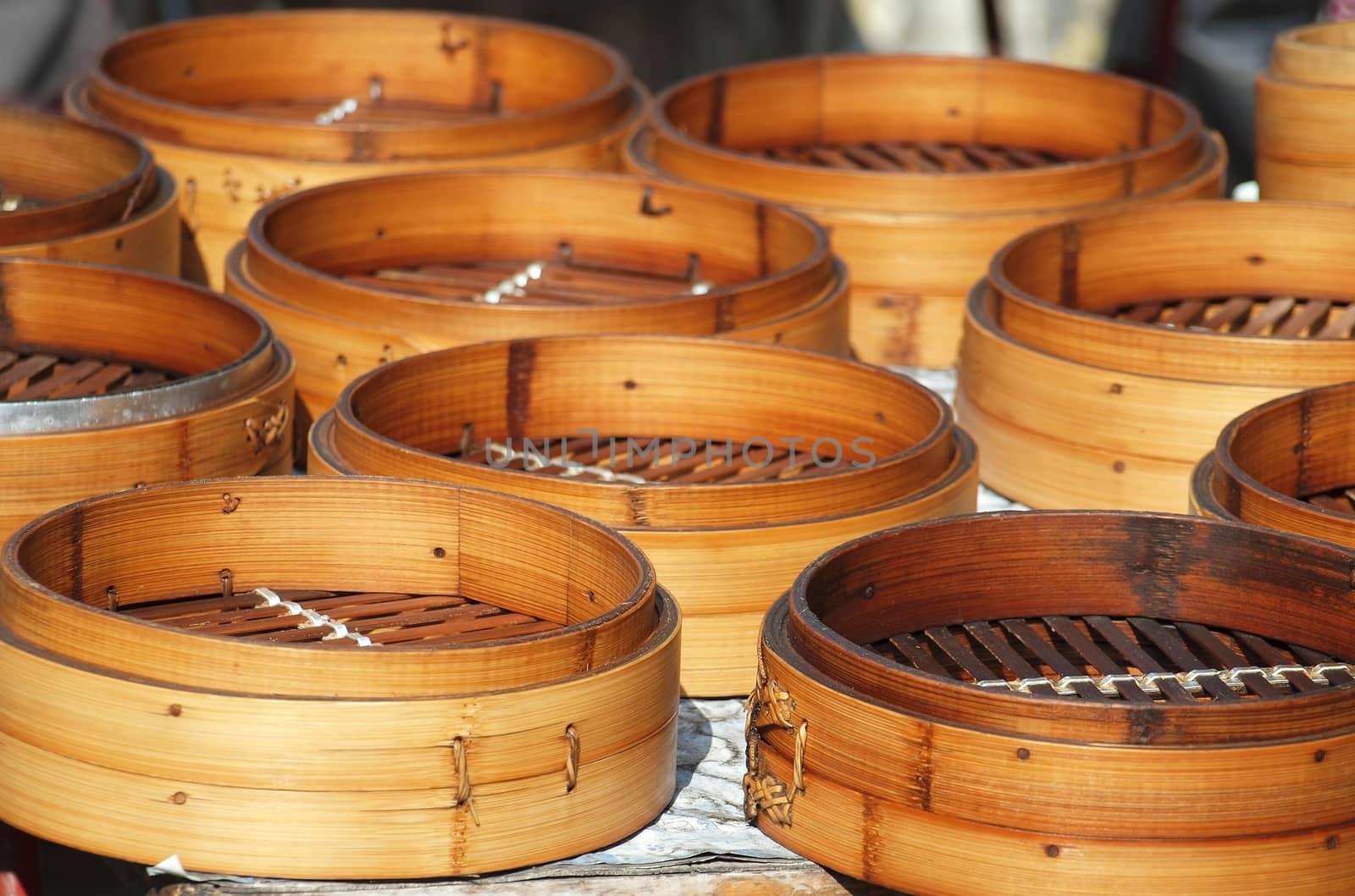 Traditional Chinese bamboo steamers used to make dumplings and steamed bread are drying in the sun