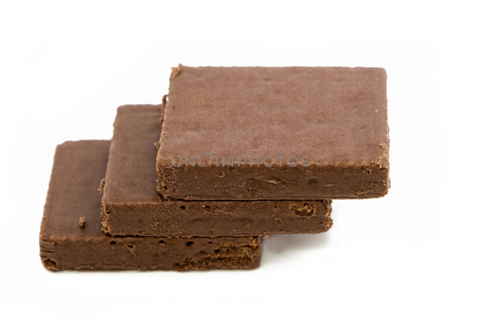 The Pieces of dark chocolate isolated on white background.