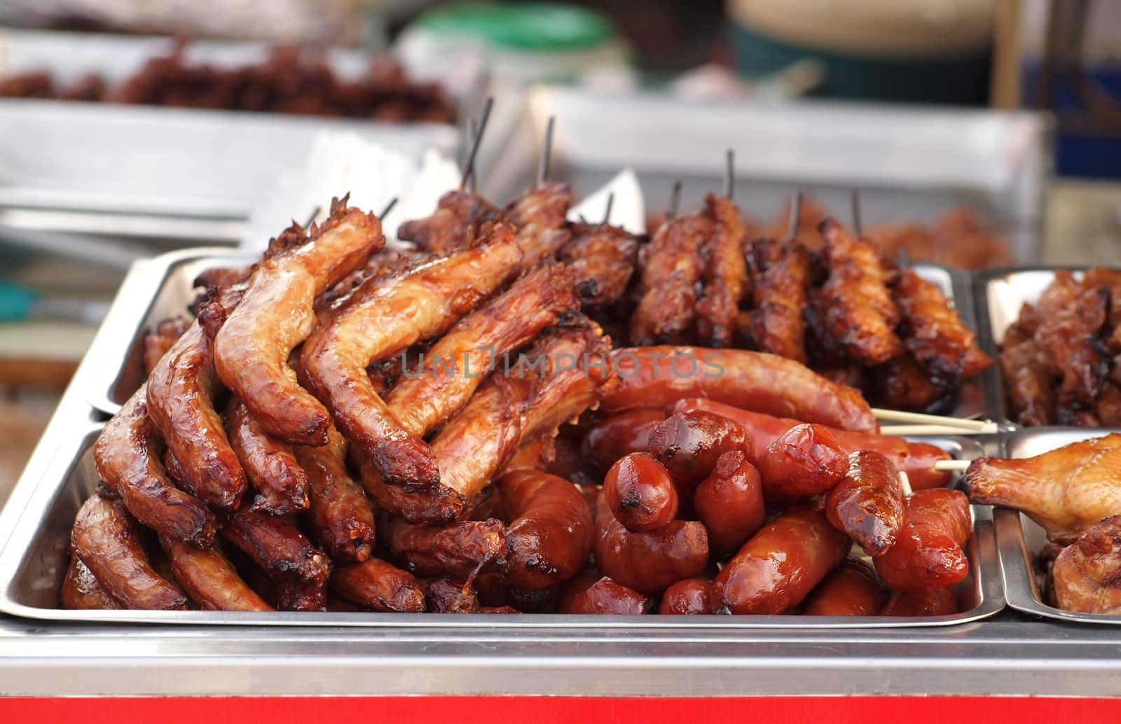 Grilled chicken necks, skewers and sausages for sale