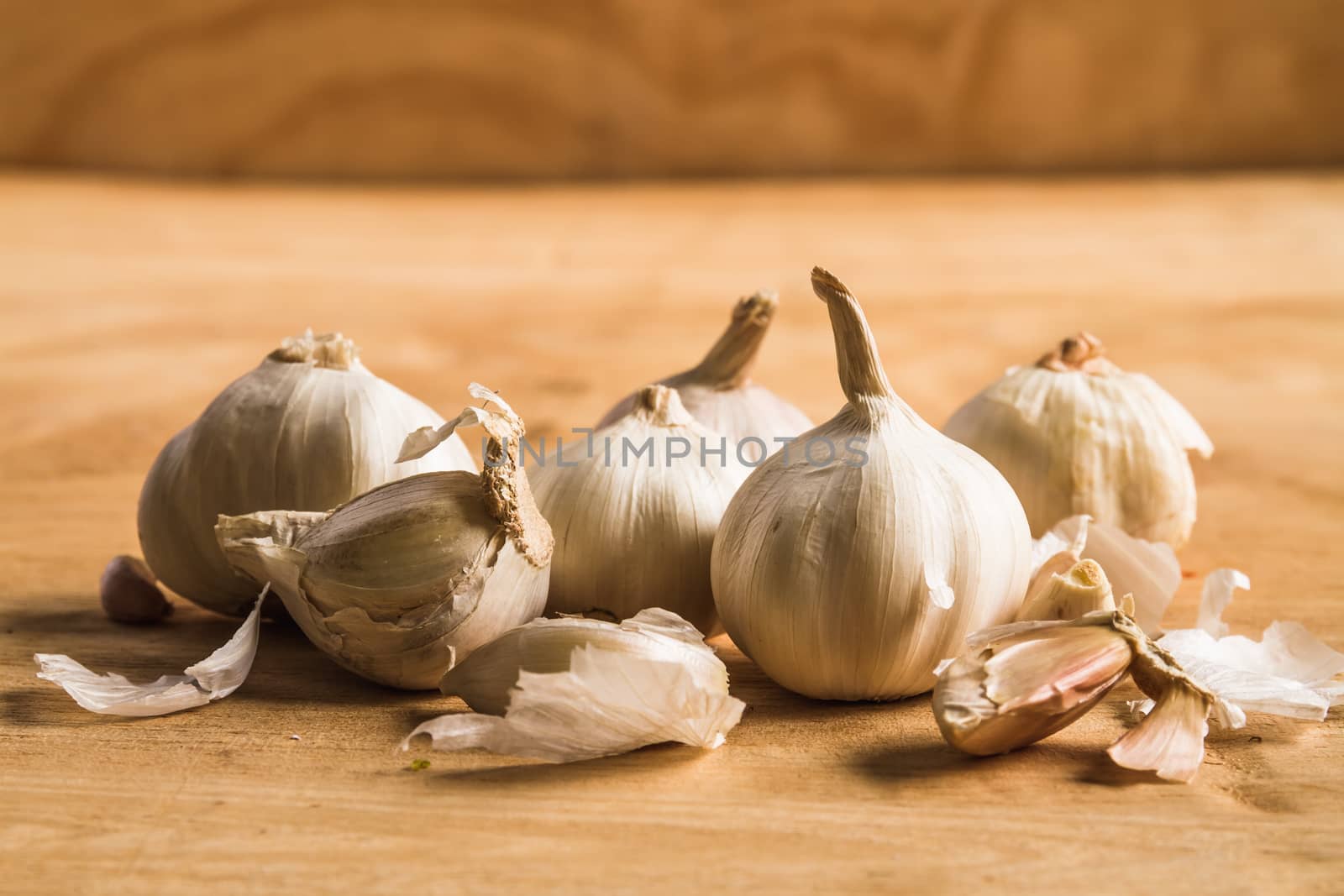 Fresh garlic on wooden table background. by ronnarong
