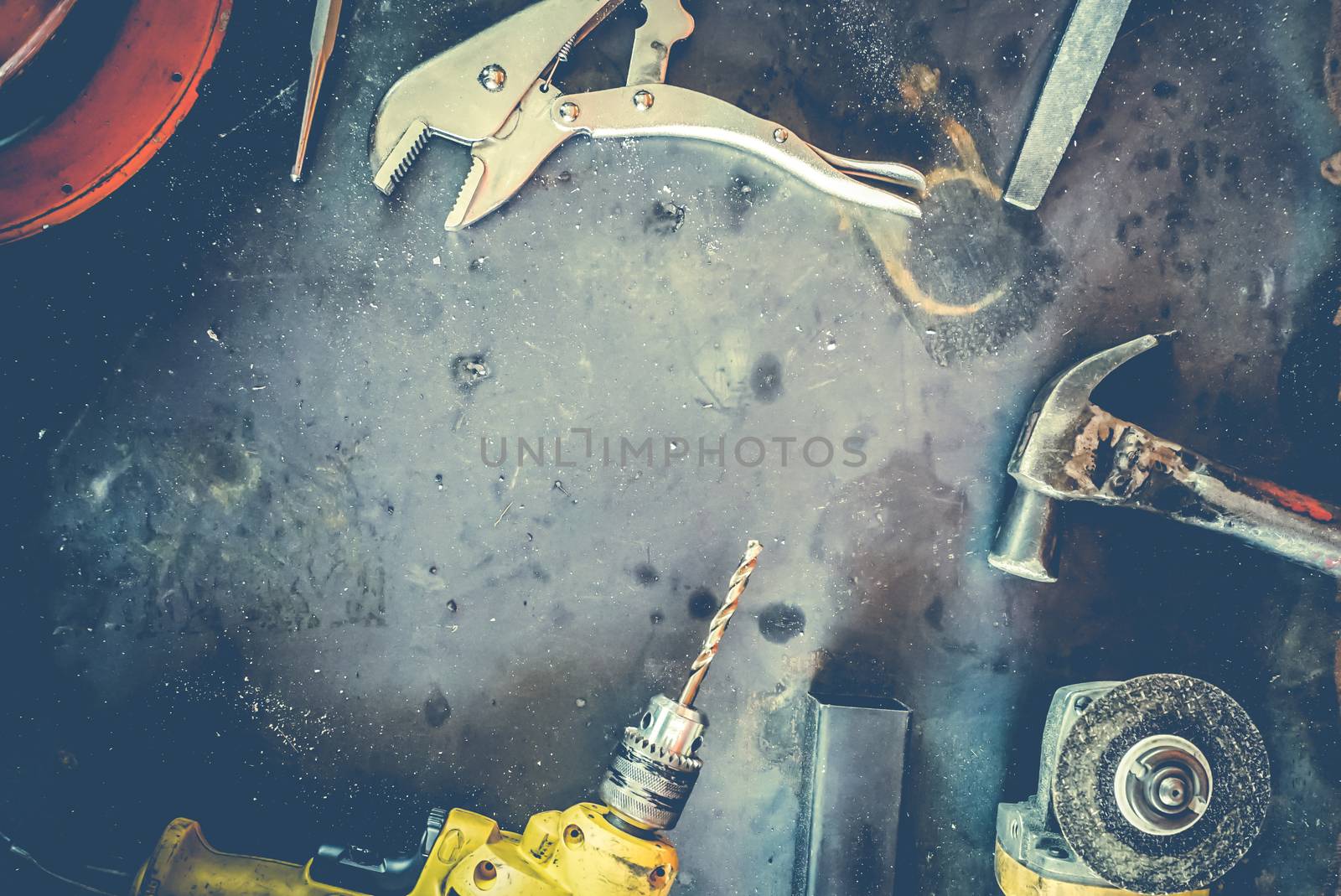 Many Tools on grunge table.View from above. Copy space.