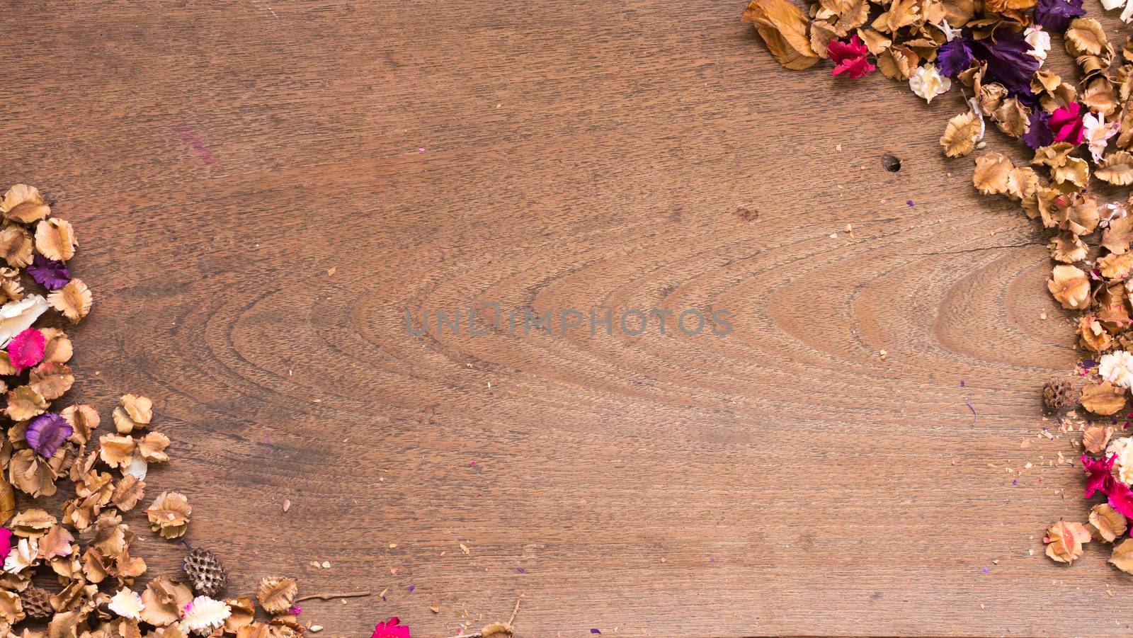 Top view workspace with dried flowers on wooden table background .Free space for your text.