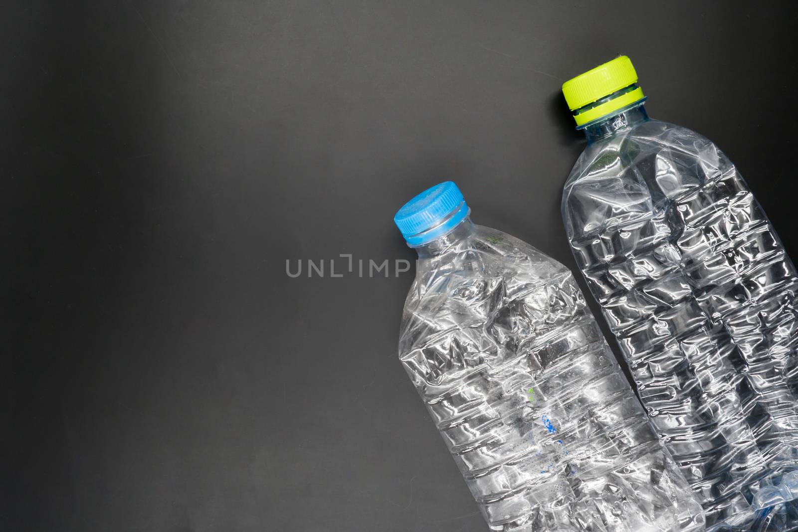 Empty plastic bottles are recyclable waste. by ronnarong