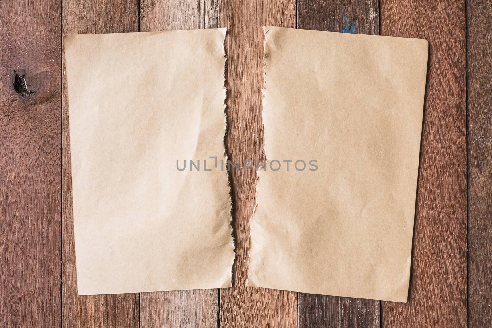 Top view of Blank brown paper on wooden table background.