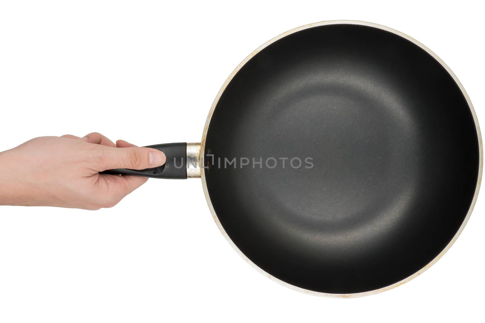 hand holding a empty pan on white background. by ronnarong