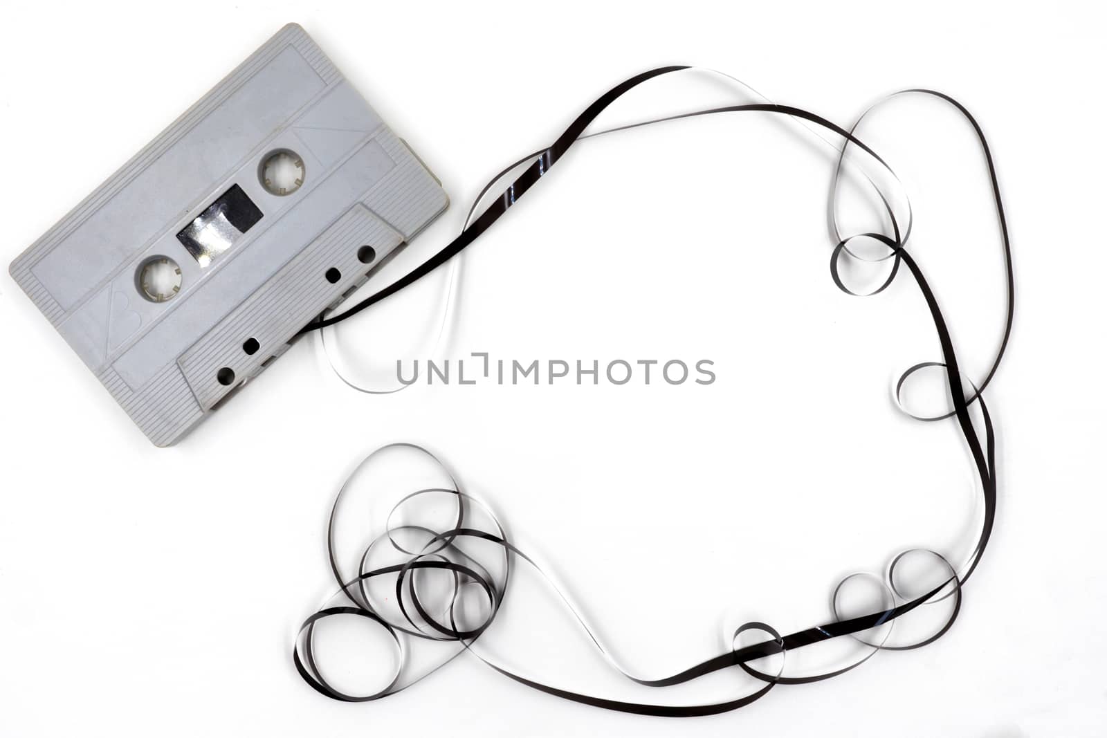 Old cassette tape on white background.