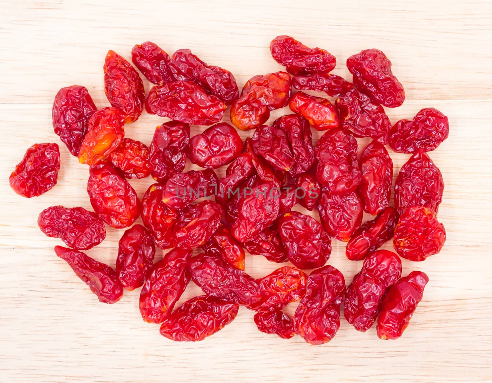 Dried Tomatoes on wood backgrund.