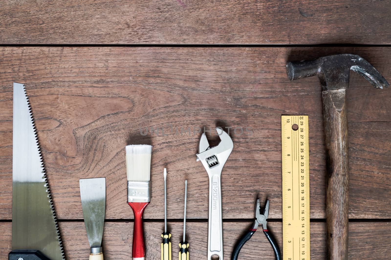 Many Tools on wooden table background.