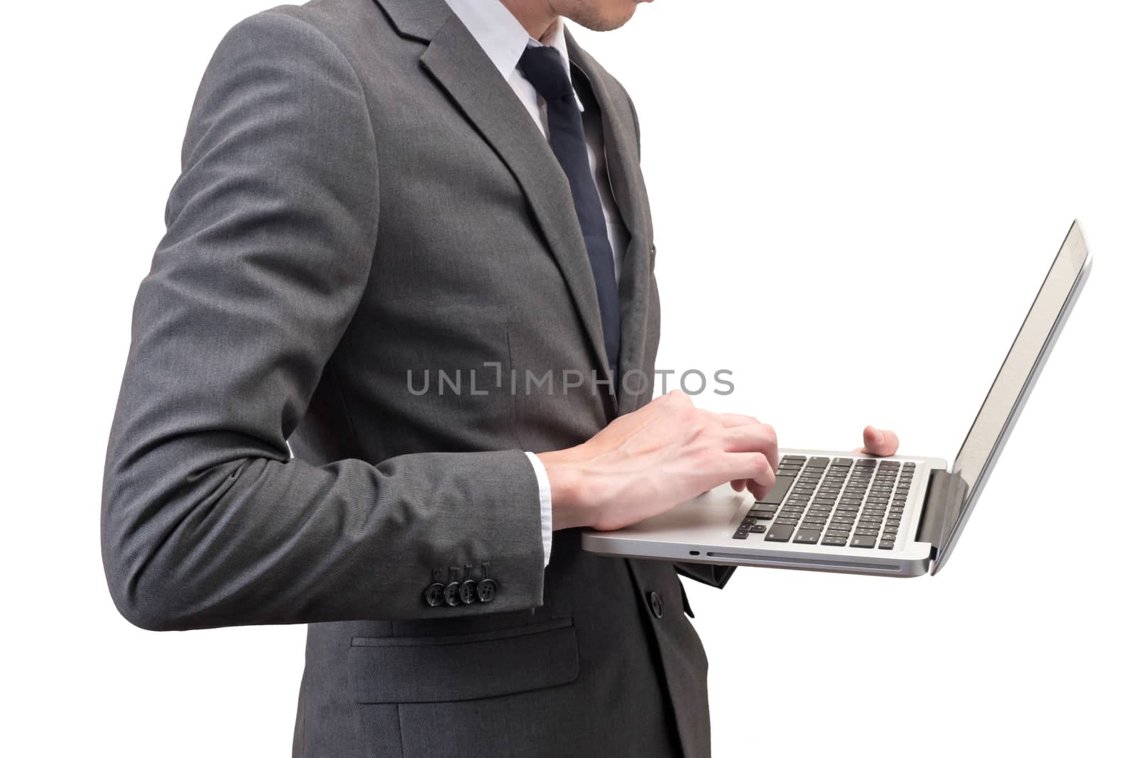 Businessman holding laptop isolated on white background.