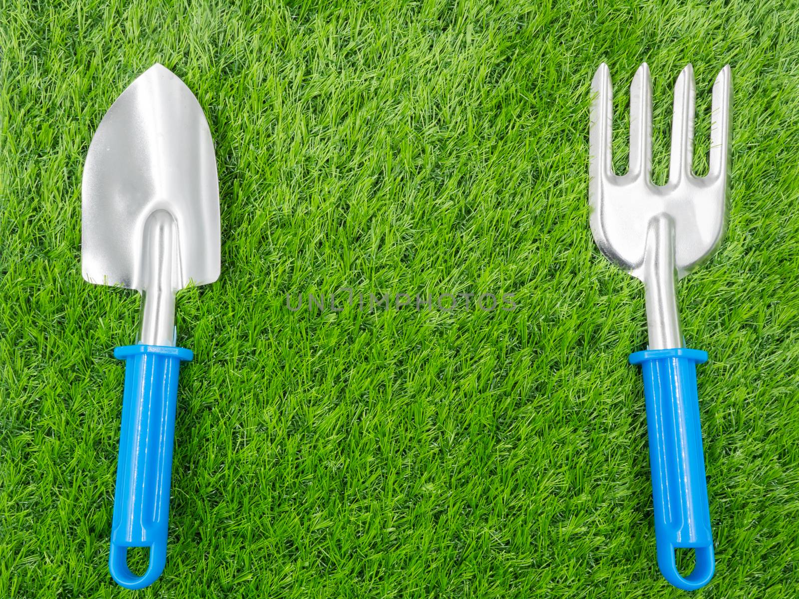 garden tools on grass background.