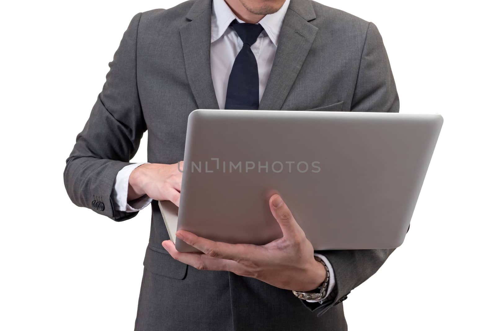 Businessman holding laptop isolated on white background.