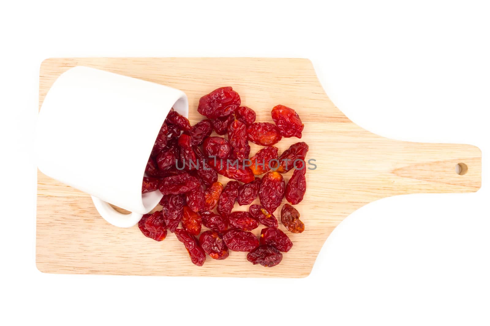 Dried Tomatoes with cup  on wooden tray.