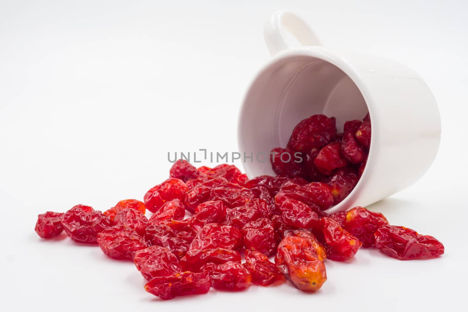 Dried Tomatoes with cup  on white backgrund.