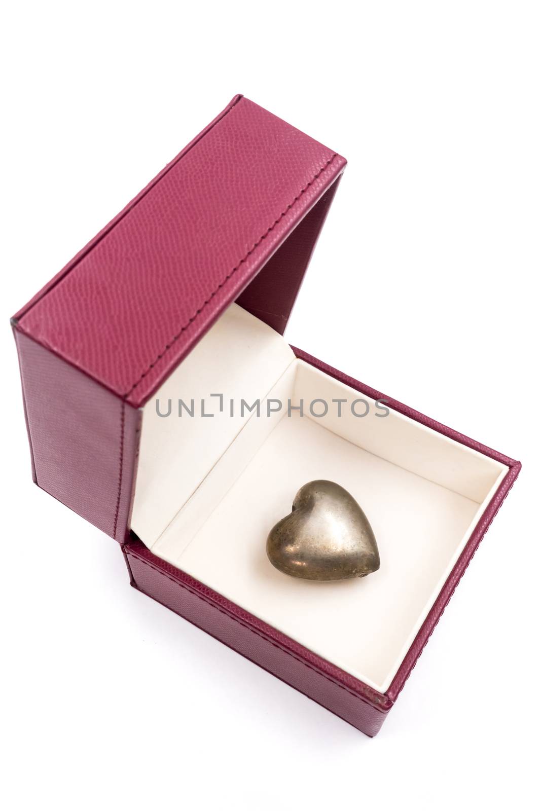 Golden heart in red gift box on white background. by ronnarong