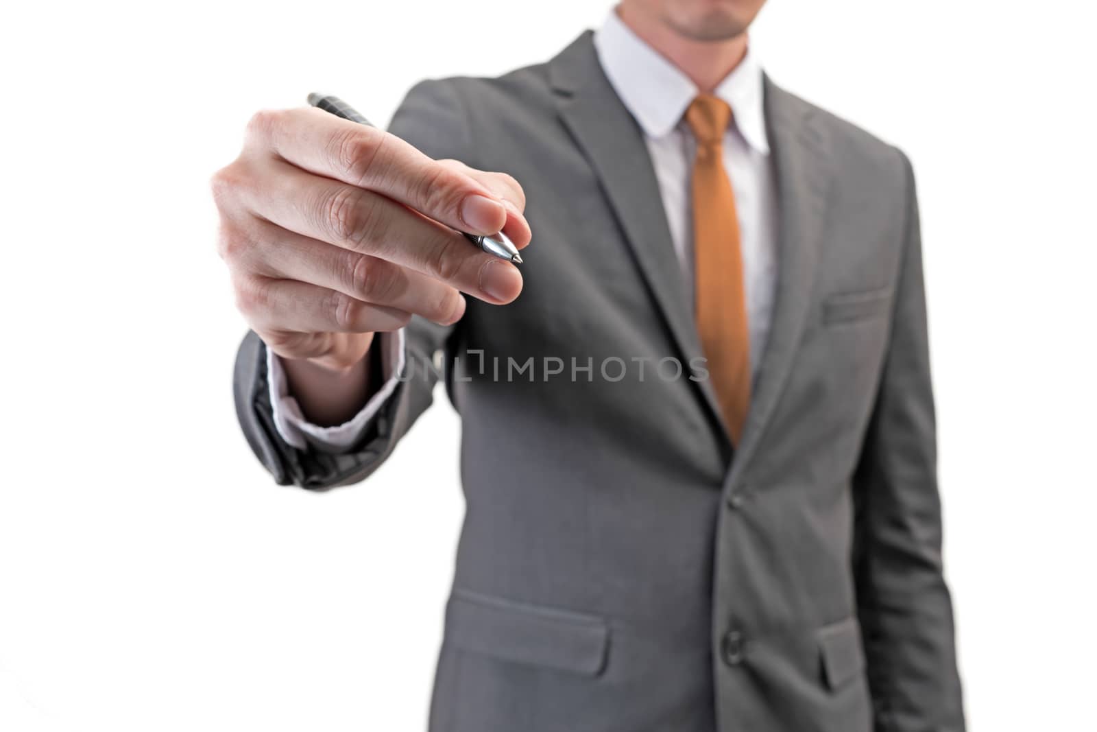 Businessman holding a pen isolated on white background.