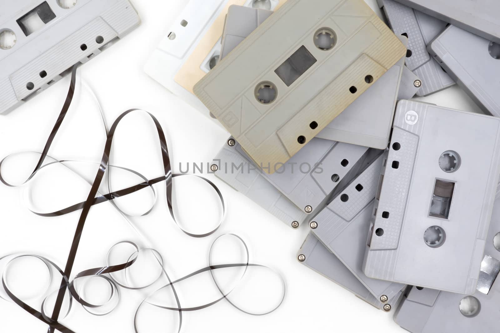 group of old cassette tapes on white background.