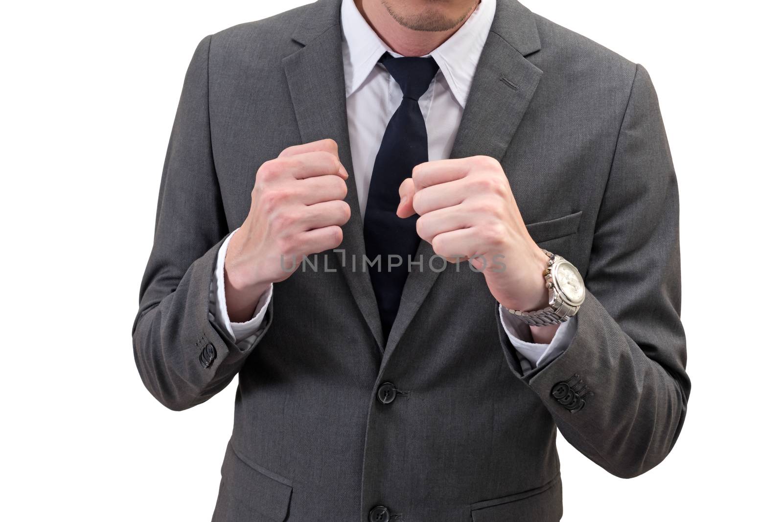 businessman holding his fists in front of him isolated on white background. business struggle