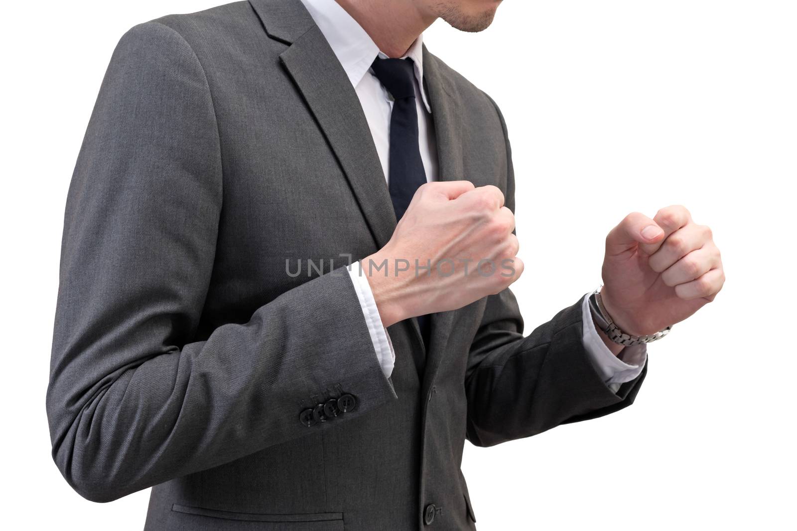 businessman holding his fists in front of him isolated on white background. business struggle