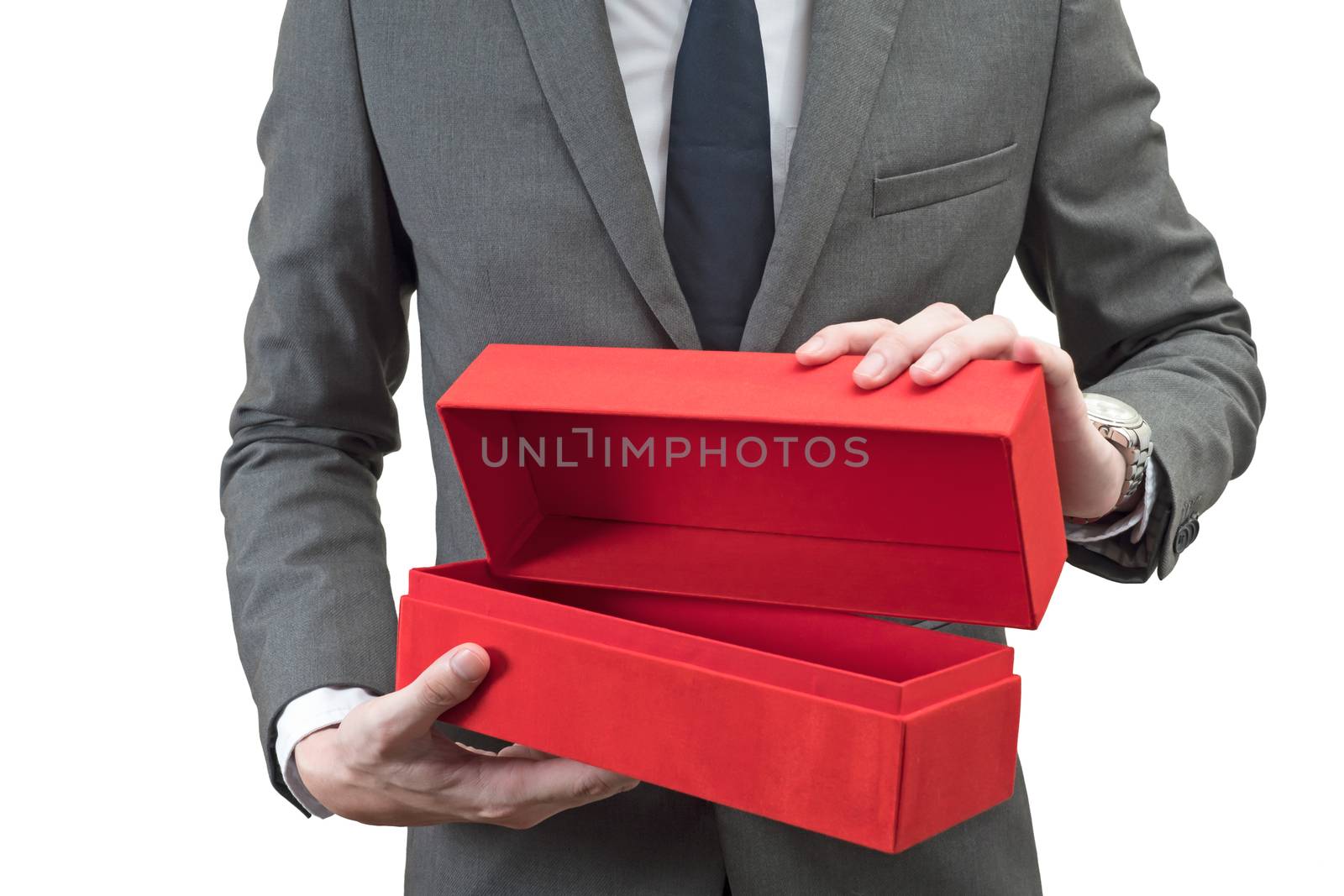 Businessman holding a red giftbox  isolated on white background.