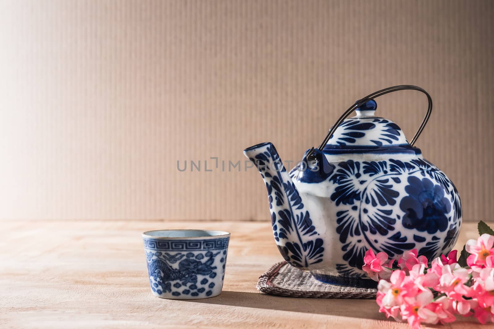 Tea pot ceramic chinese style on the wooden table.