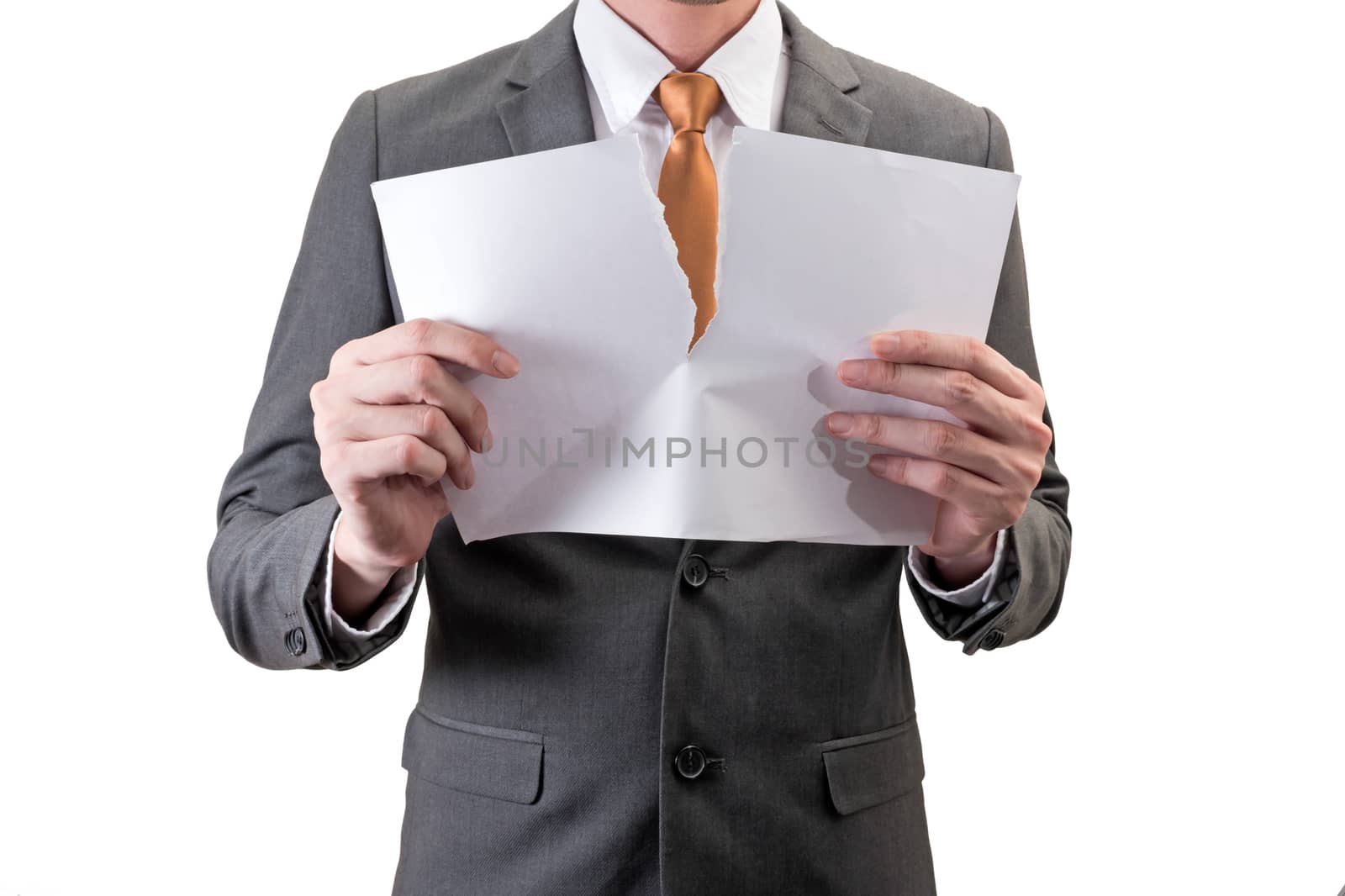 Businessman tearing white paper isolated on white background.