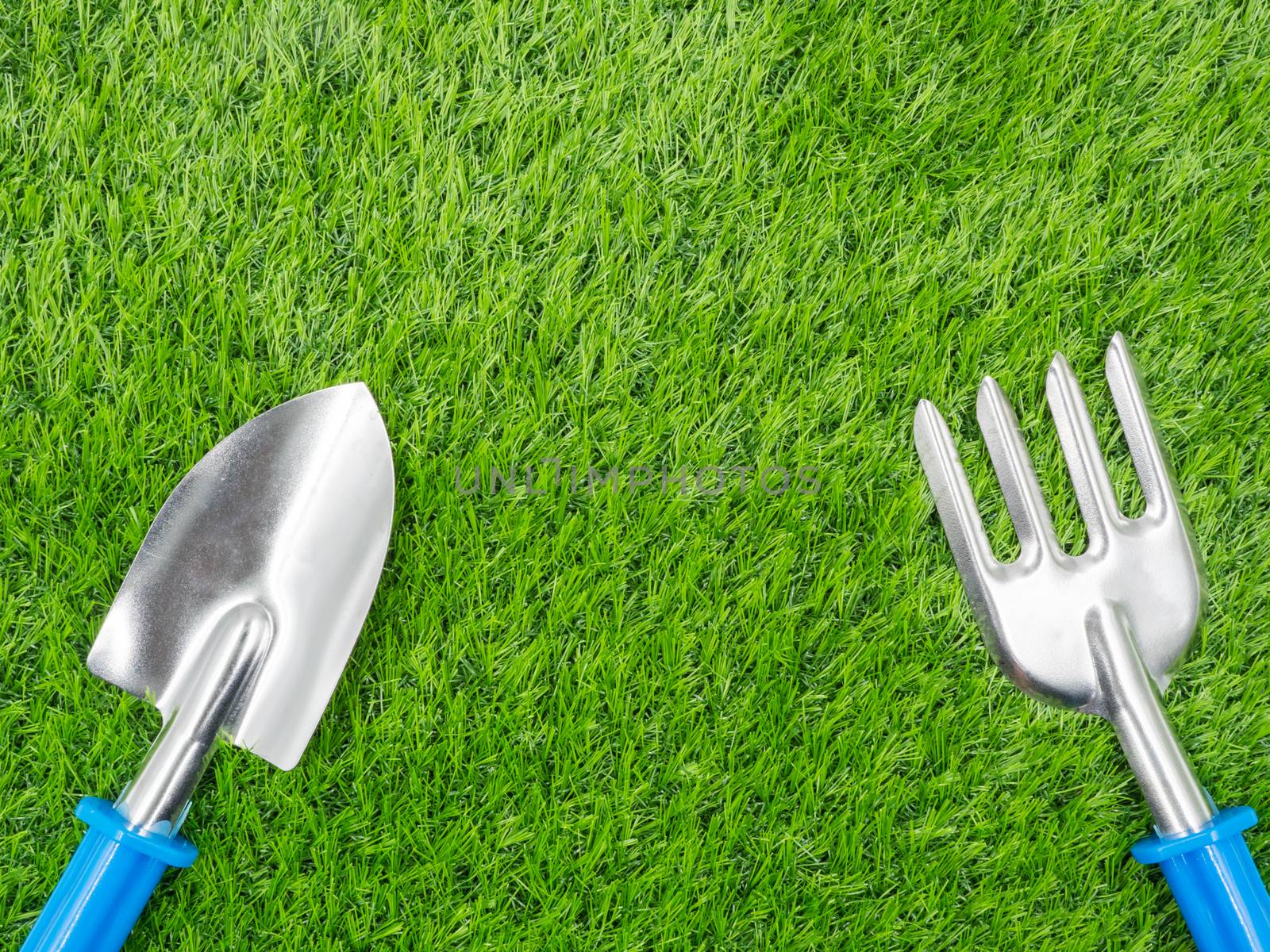 garden tools on grass background.