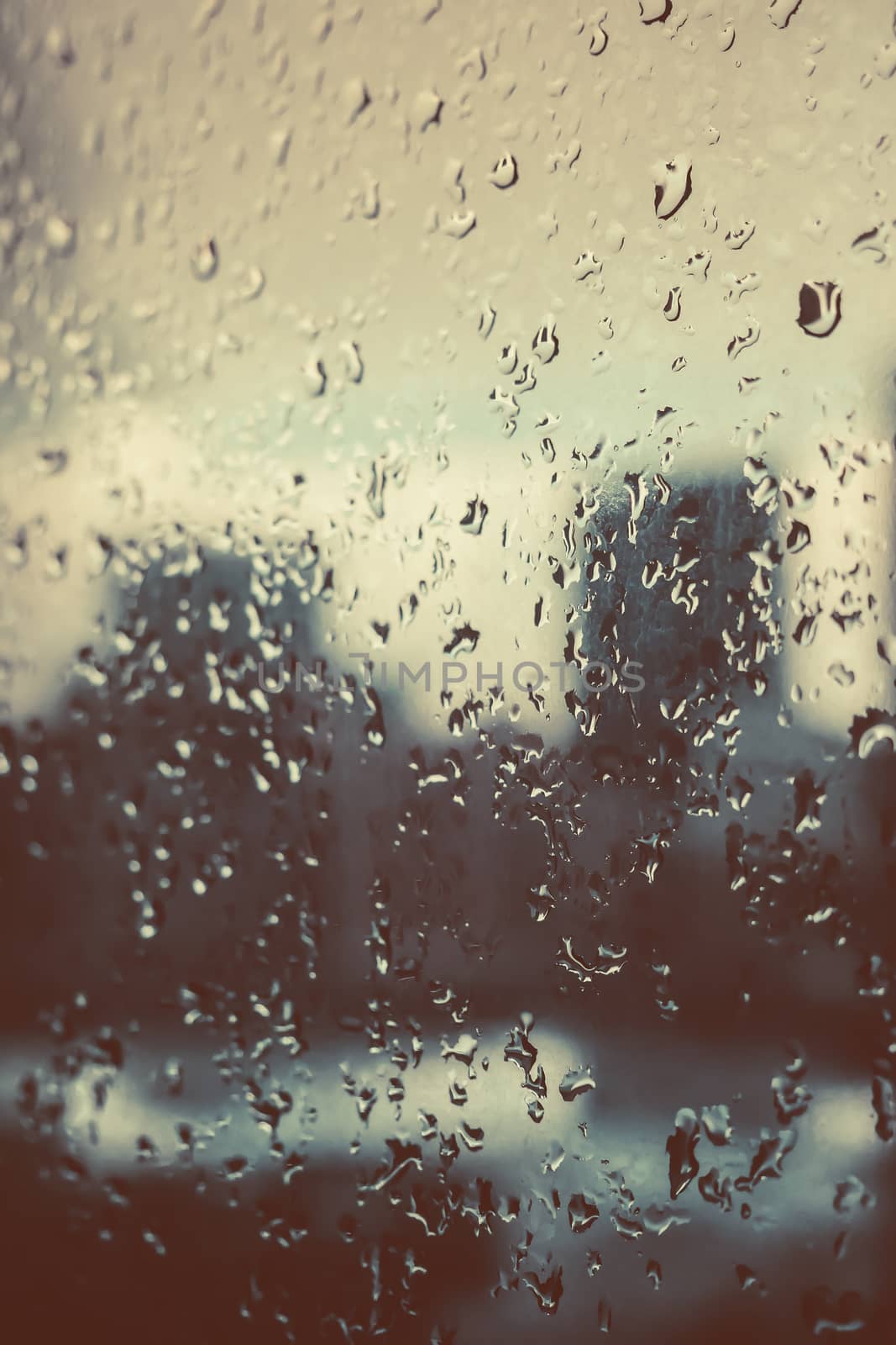 Raindrops on the glass window.vintage tone