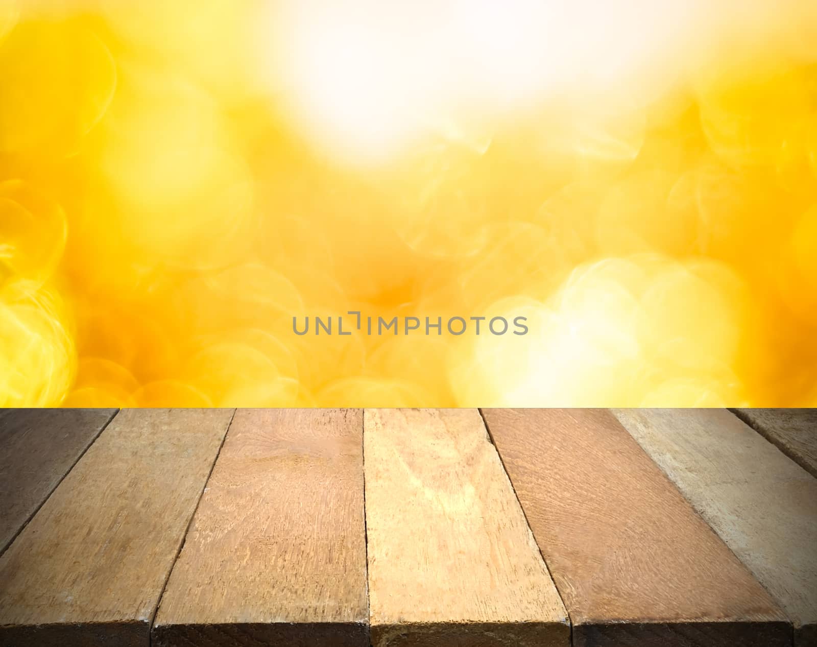 Empty wooden table in front of bokeh lights background.