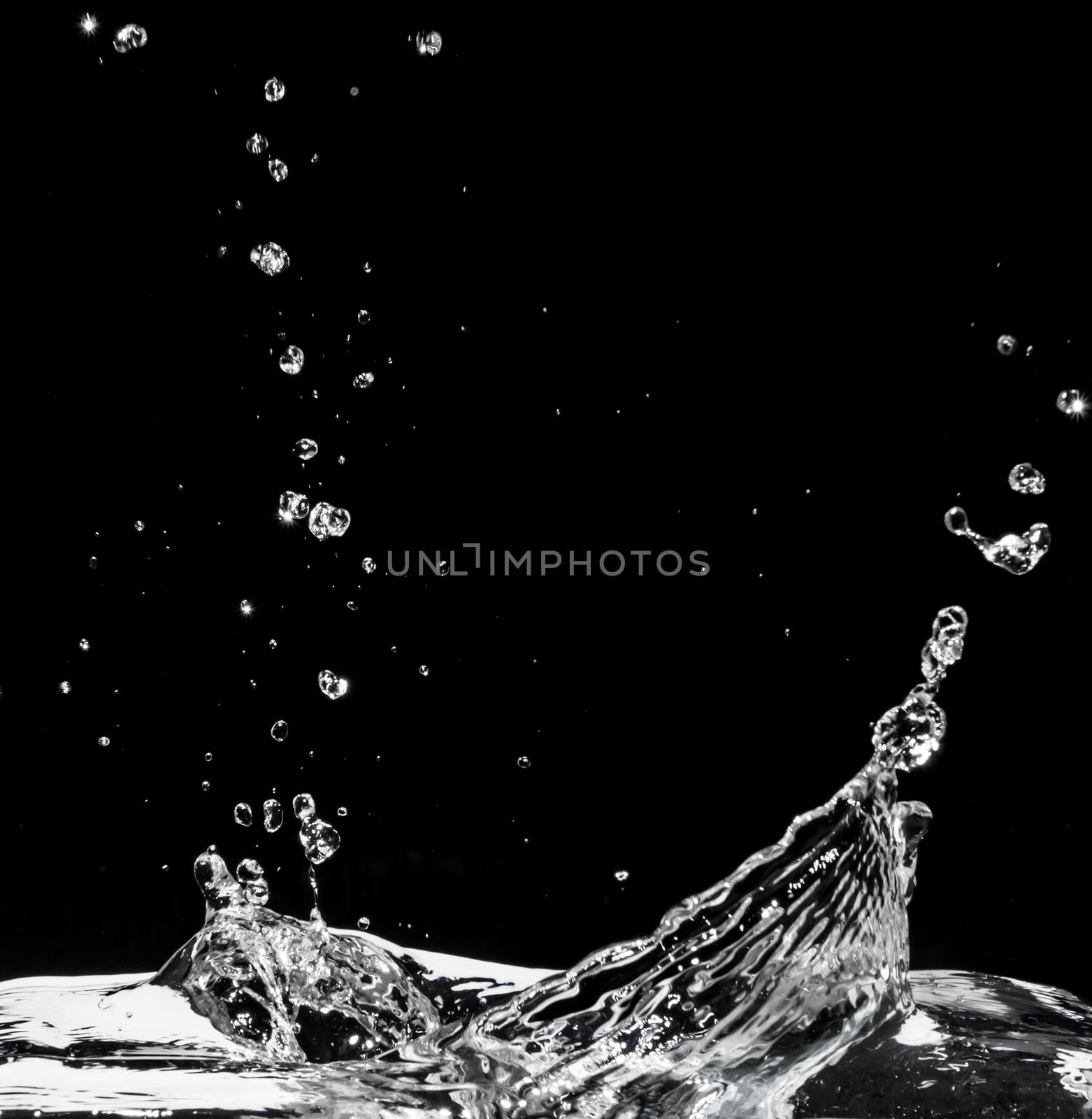 Water splash isolated on black background by ronnarong